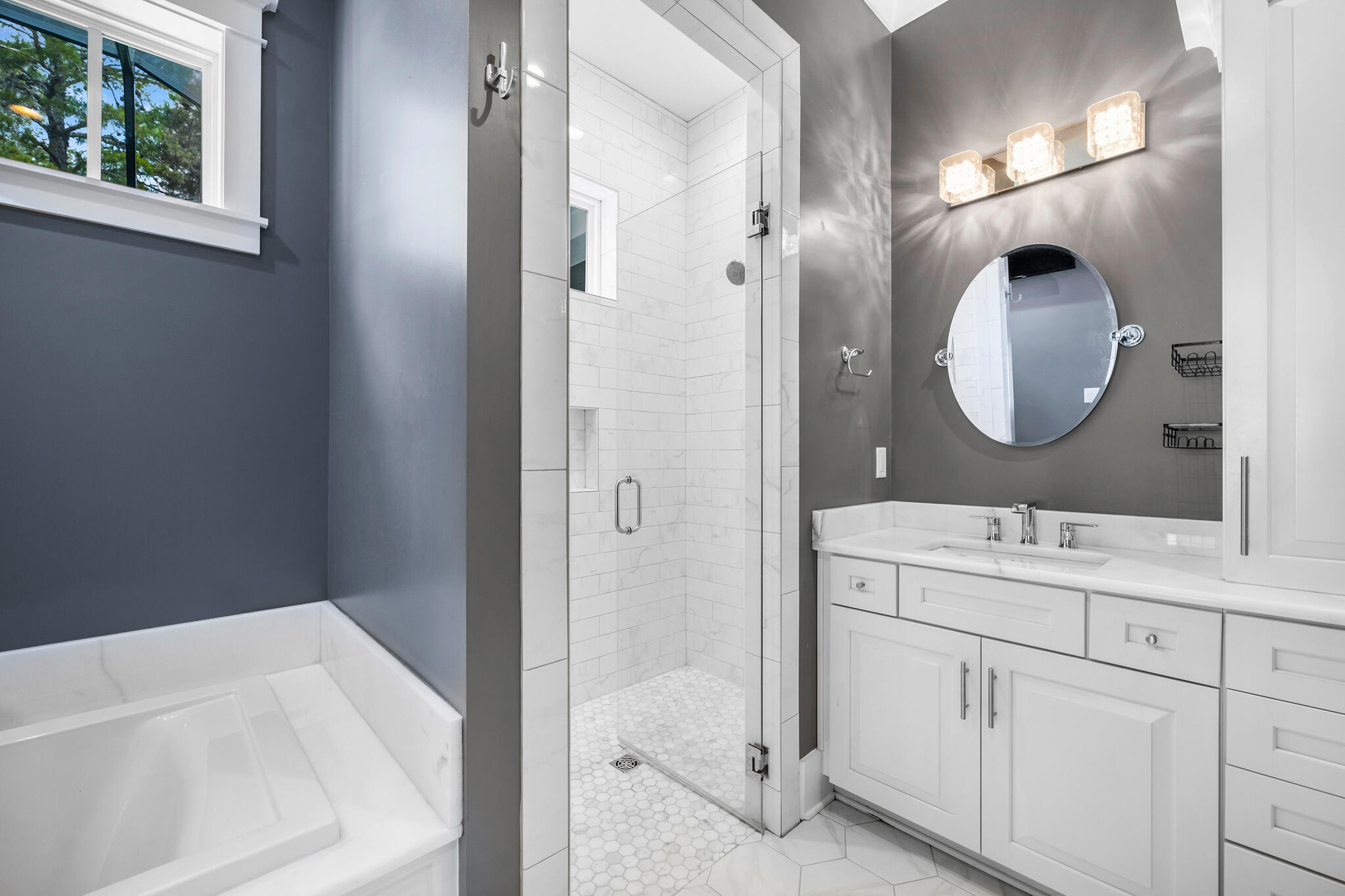 61 Blue Lake Road Santa Rosa Beach, FL 32459 - Photo 24 of 66 a en suite bathroom with a sink and a mirror