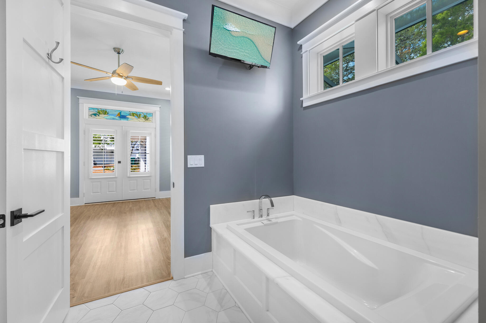 61 Blue Lake Road Santa Rosa Beach, FL 32459 - Photo 26 of 66 a bathroom with a tub and a window