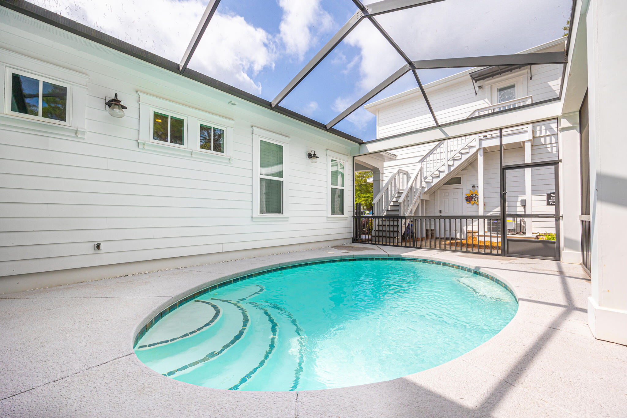 61 Blue Lake Road Santa Rosa Beach, FL 32459 - Photo 39 of 66 a view of a swimming pool with a patio