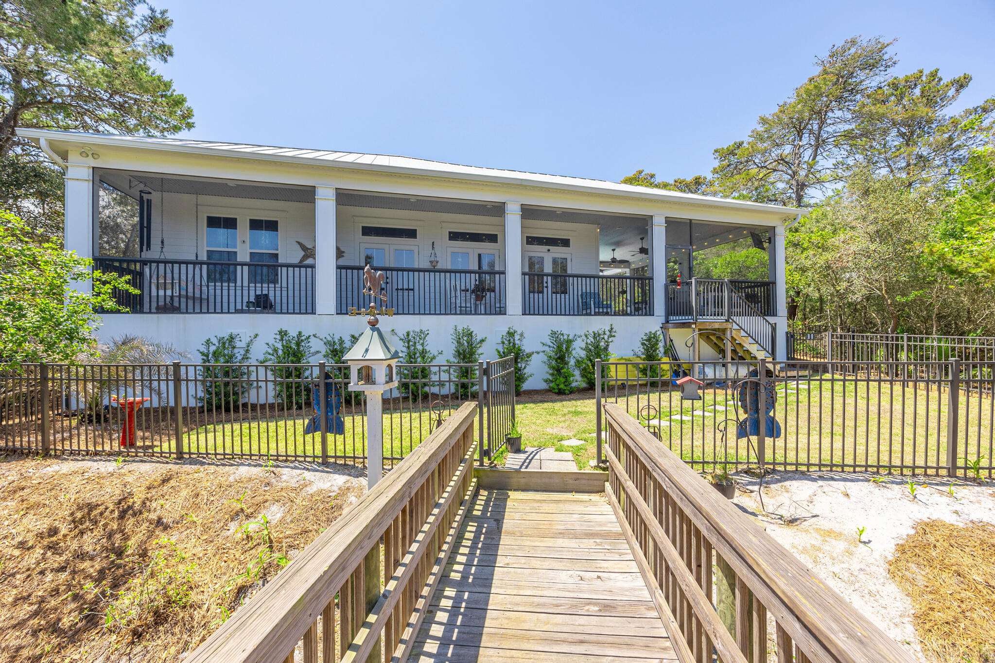 61 Blue Lake Road Santa Rosa Beach, FL 32459 - Photo 40 of 66 a view of swimming pool with a patio and a garden