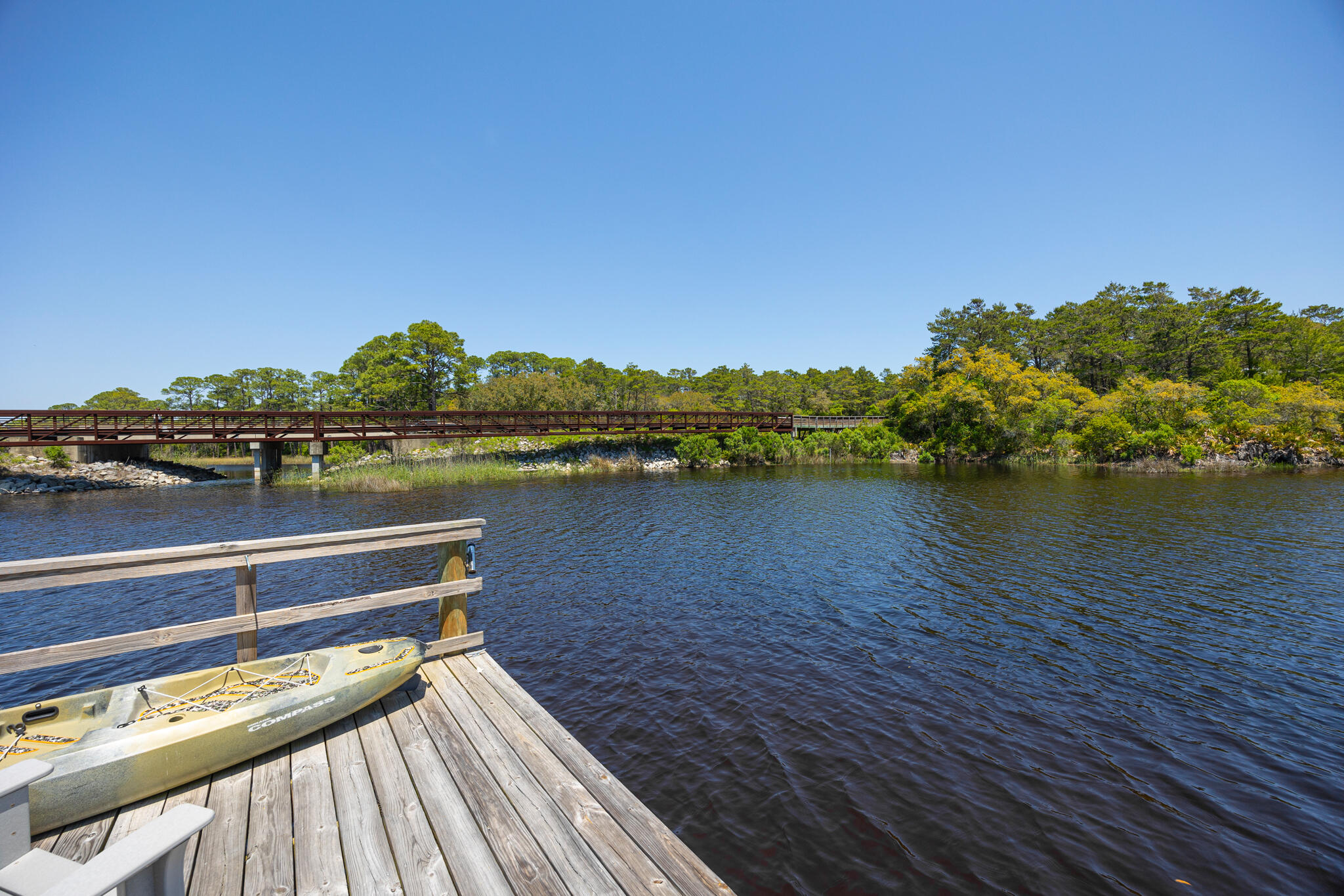 61 Blue Lake Road Santa Rosa Beach, FL 32459 - Photo 47 of 66 a view of a lake with houses
