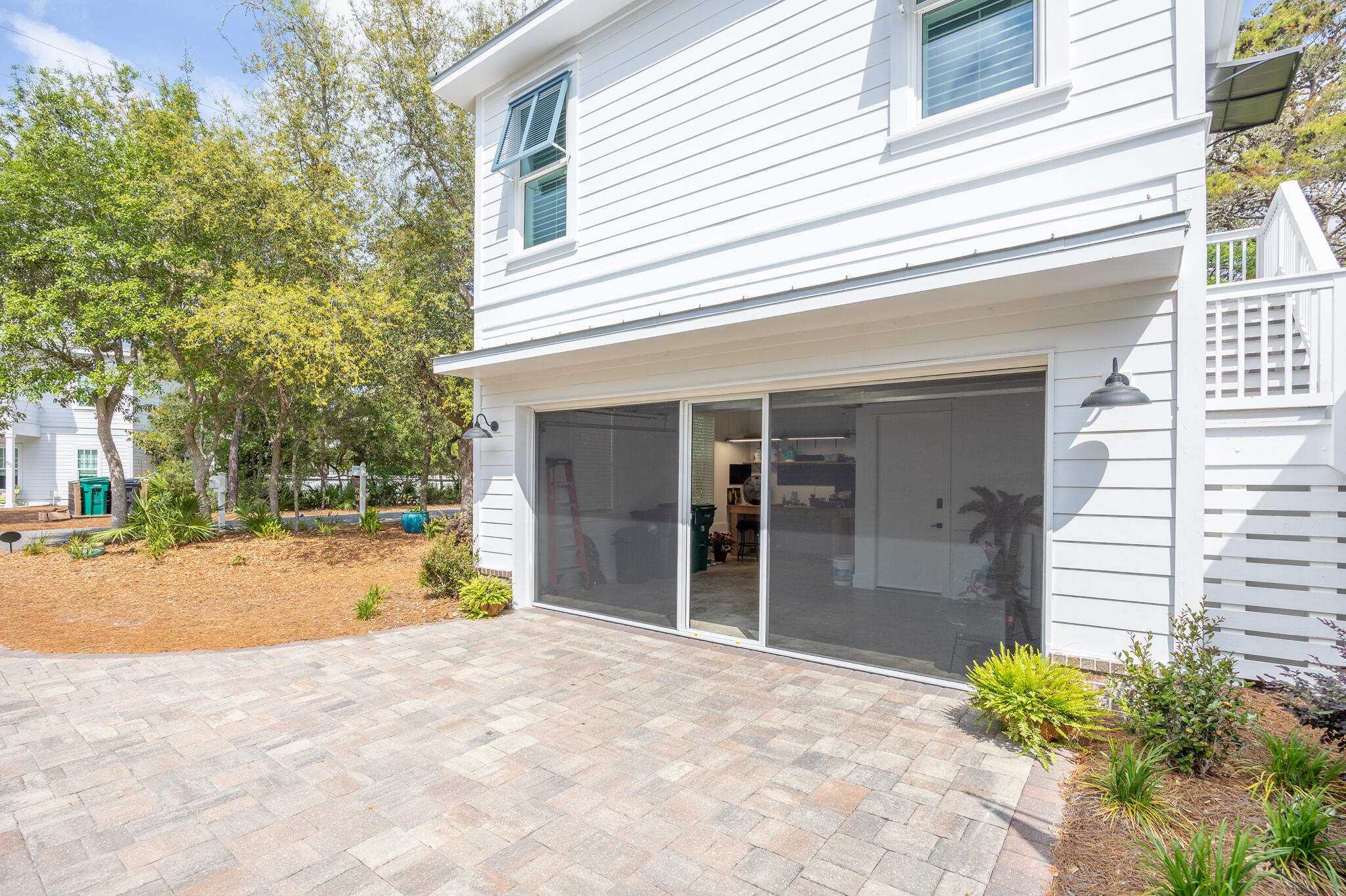 61 Blue Lake Road Santa Rosa Beach, FL 32459 - Photo 49 of 66 a view of a house with backyard and a tree