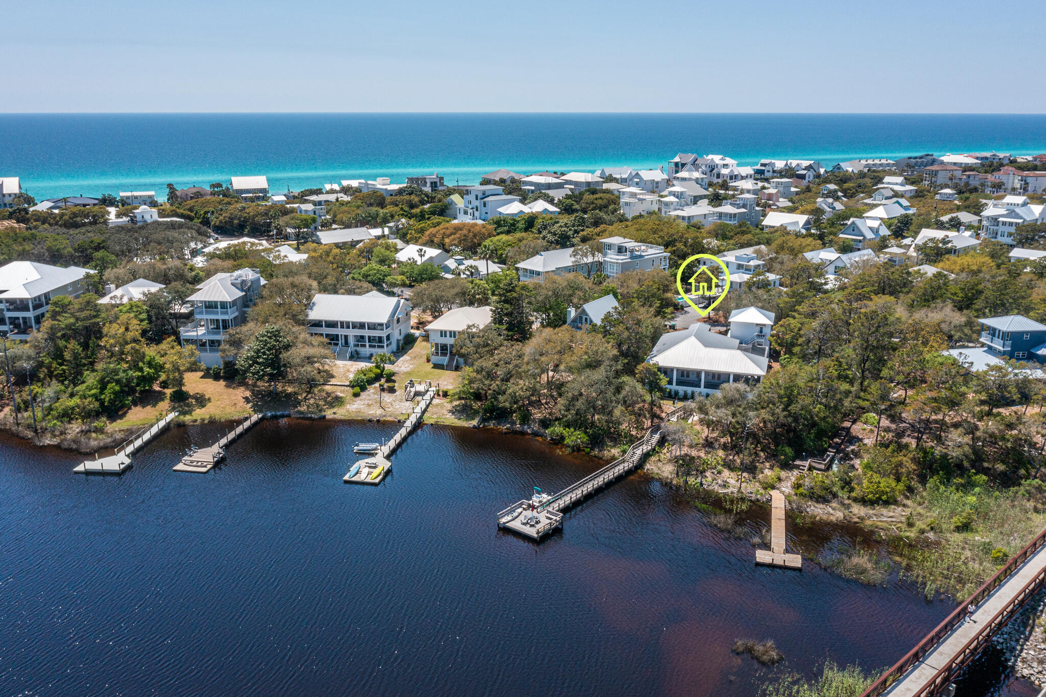 61 Blue Lake Road Santa Rosa Beach, FL 32459 - Photo 66 of 66 an aerial view of residential houses with outdoor space and parking