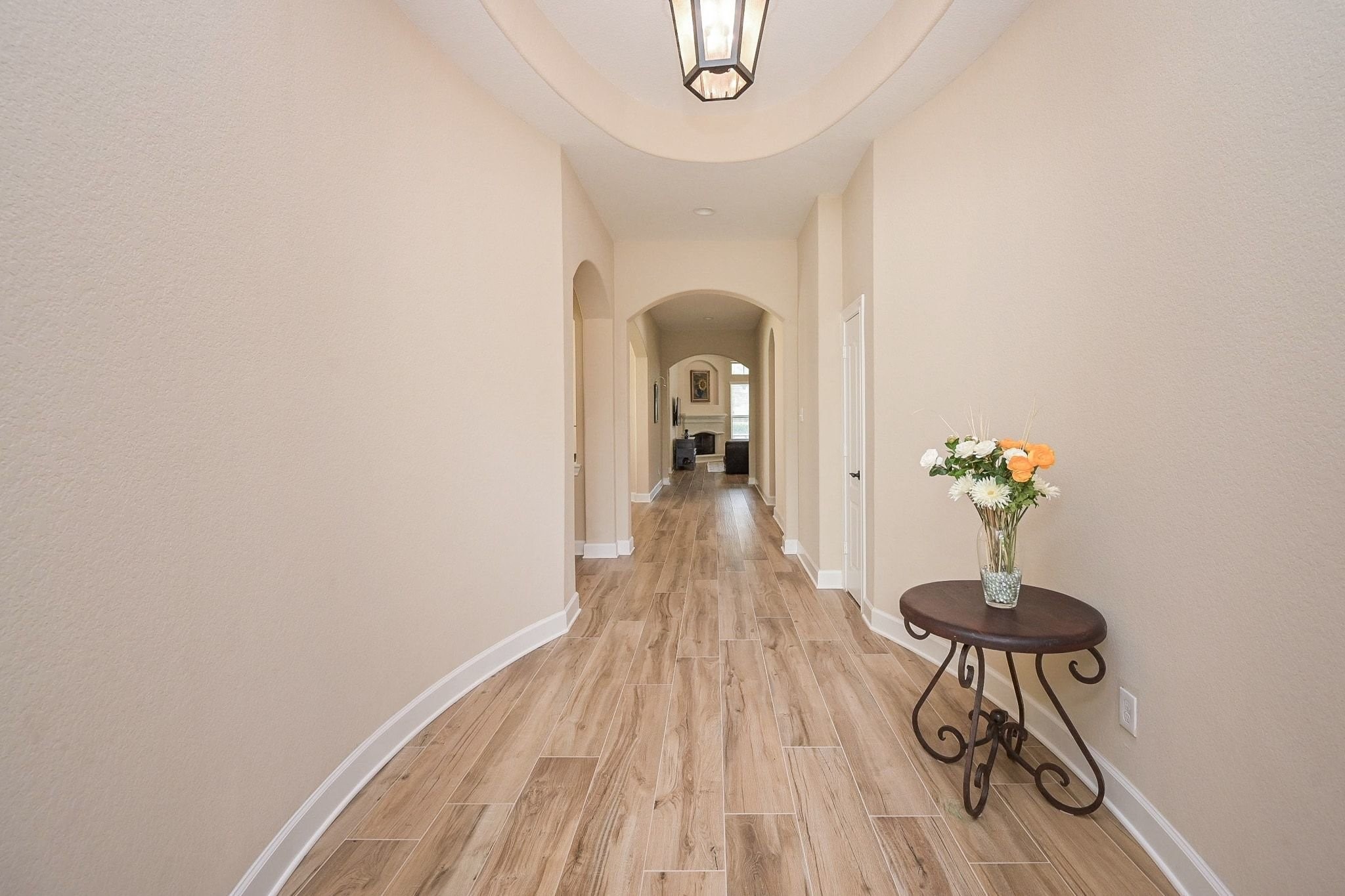 107 North Bacopa Drive Spring, TX 77389 - Photo 6 of 34 Bright entry hallway with high ceilings and soft natural light, leading seamlessly into the main living areas.