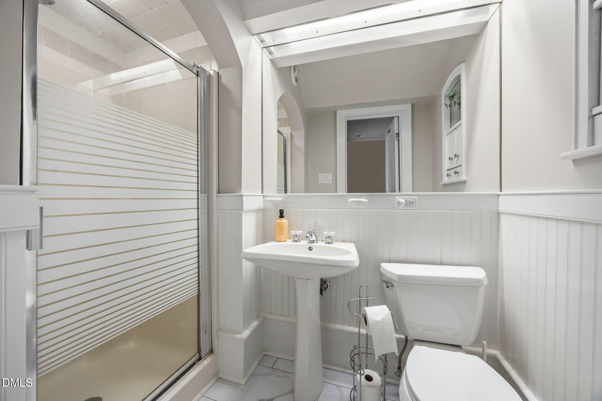 554 South Main Street Wake Forest, NC 27587 - Photo 28 of 78 a bathroom with a toilet a sink and mirror