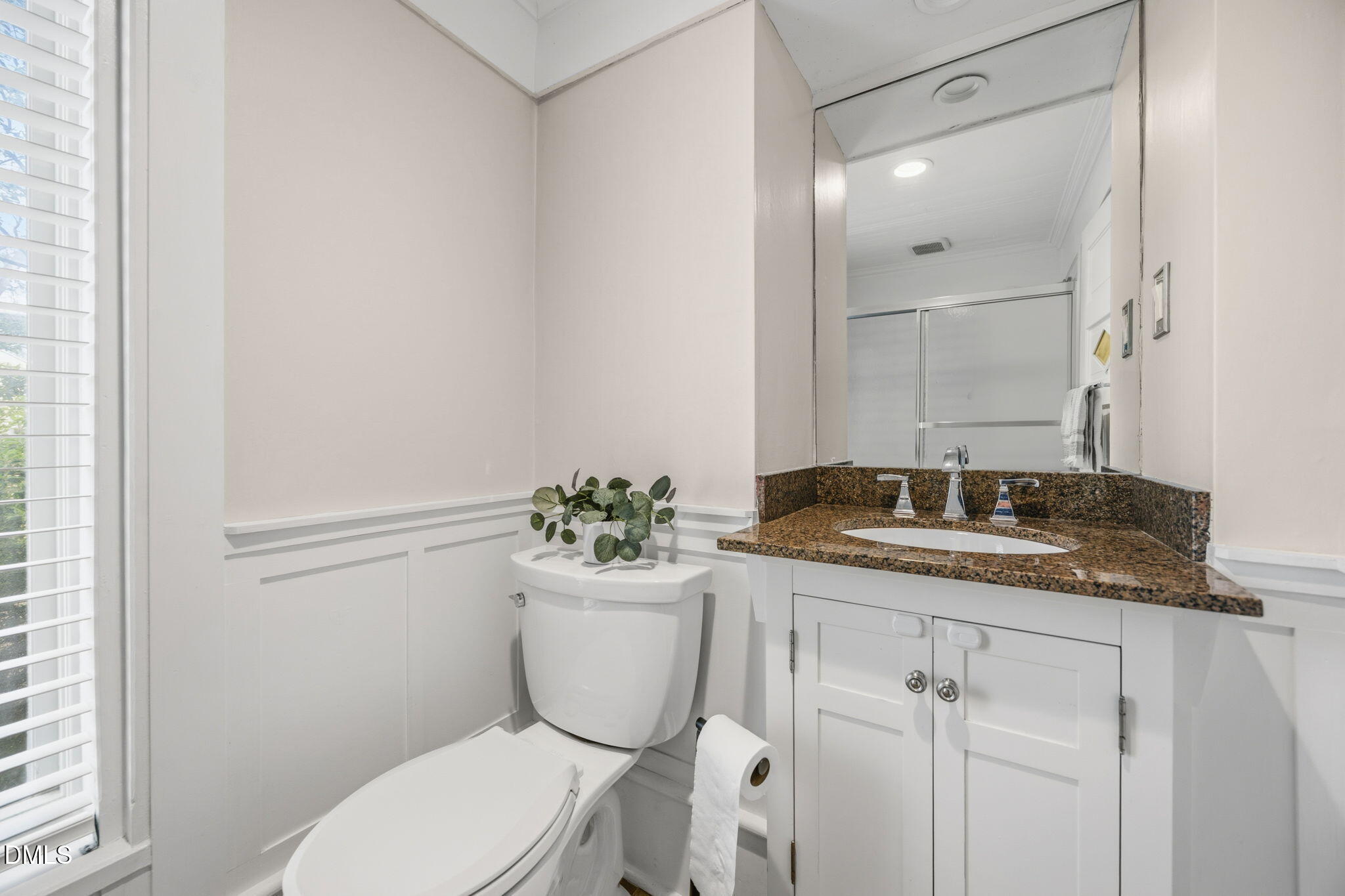 554 South Main Street Wake Forest, NC 27587 - Photo 36 of 78 a bathroom with a granite countertop toilet sink and mirror
