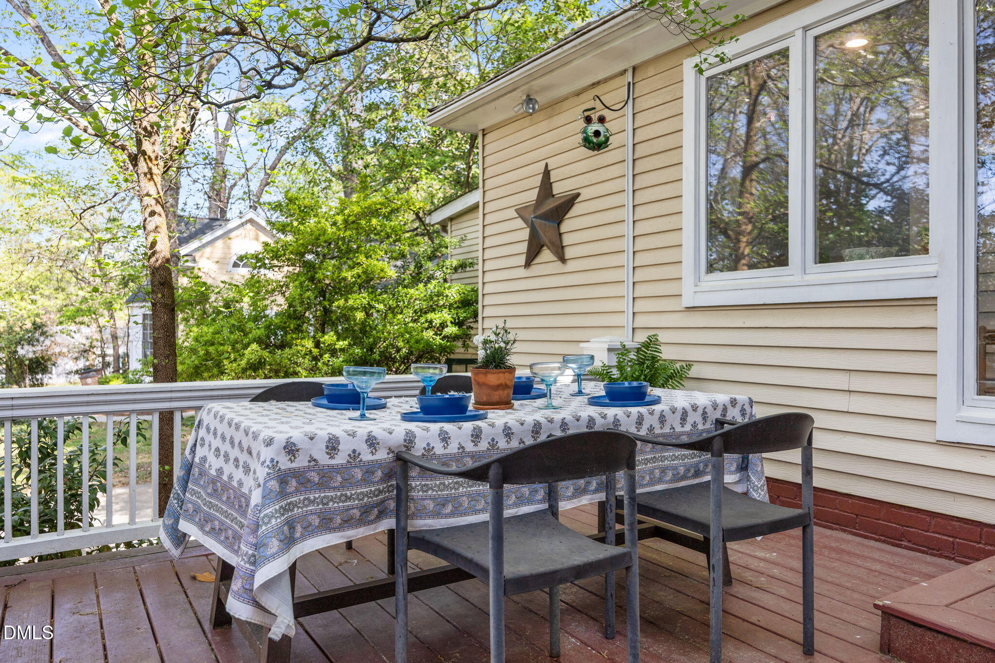 554 South Main Street Wake Forest, NC 27587 - Photo 41 of 78 a view of a patio with table and chairs and wooden floor