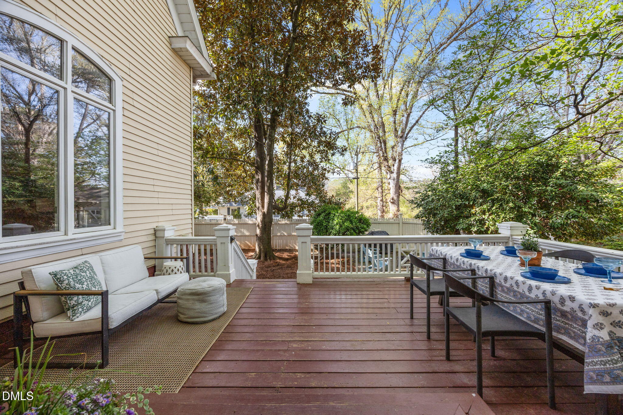 554 South Main Street Wake Forest, NC 27587 - Photo 42 of 78 a view of a patio with table and chairs and wooden floor