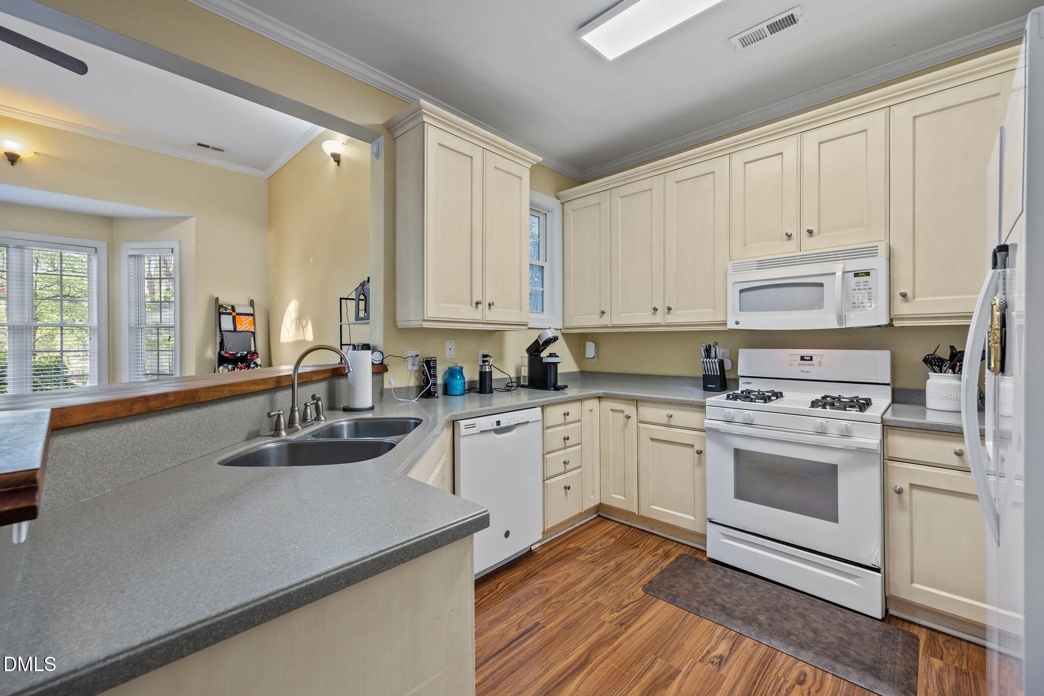 554 South Main Street Wake Forest, NC 27587 - Photo 63 of 78 a kitchen with white cabinets sink and white appliances