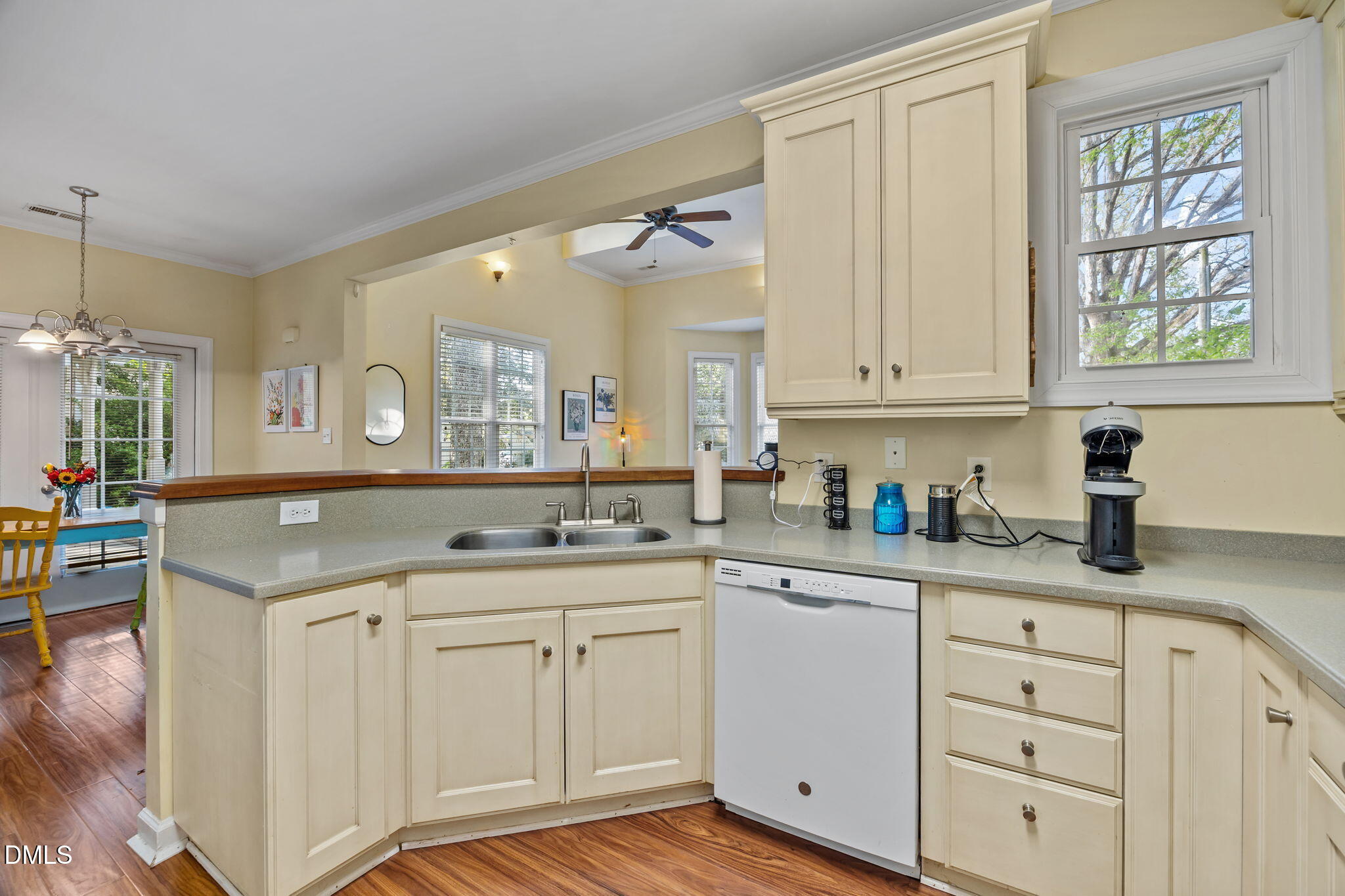 554 South Main Street Wake Forest, NC 27587 - Photo 64 of 78 a kitchen with granite countertop a sink cabinets stainless steel appliances and a window