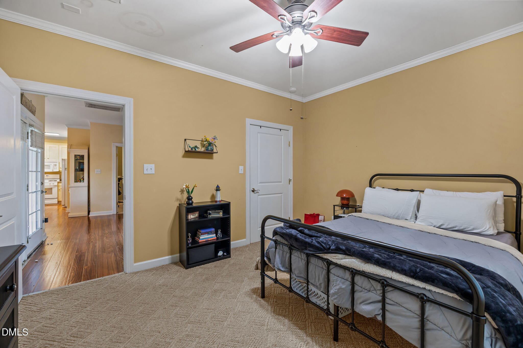 554 South Main Street Wake Forest, NC 27587 - Photo 69 of 78 a bedroom with a bed and a chandelier