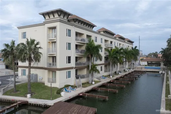a view of a tall building with a lake view