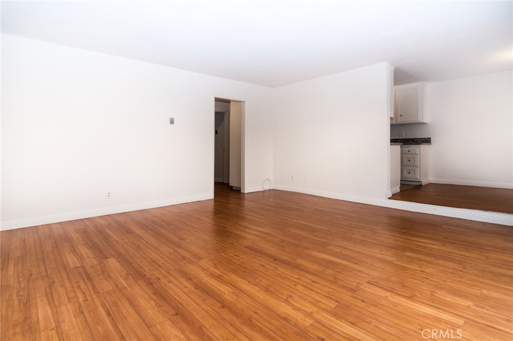 1122 9th Street, Unit 4 Santa Monica, CA 90403 - Photo 6 of 18 a view of an empty room with wooden floor