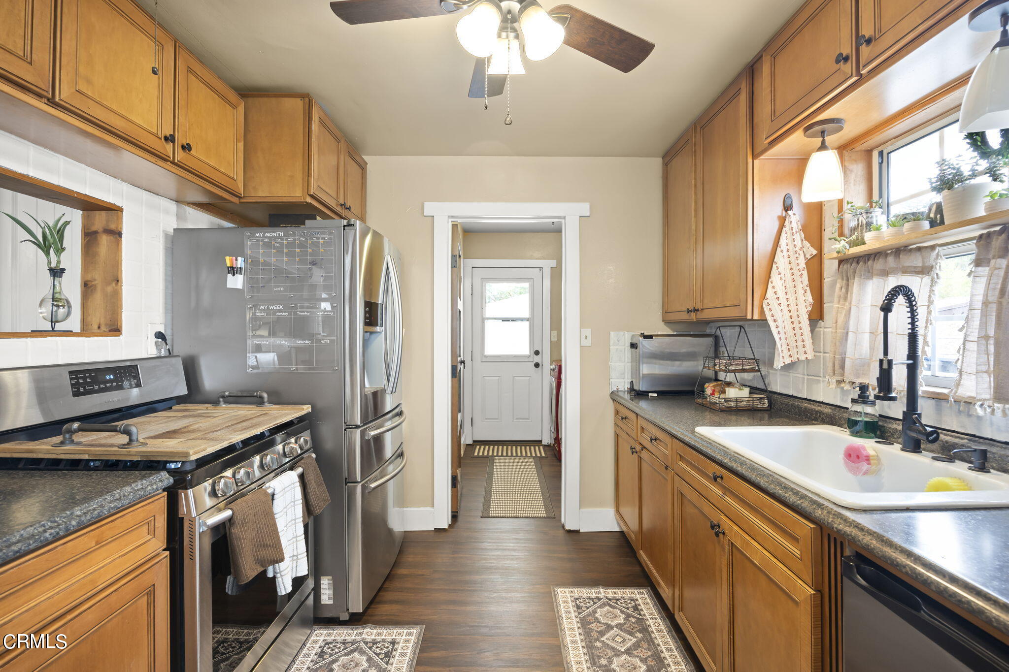 929 Devereux Drive Ojai, CA 93023 - Photo 13 of 40 a kitchen with a sink stove and cabinets