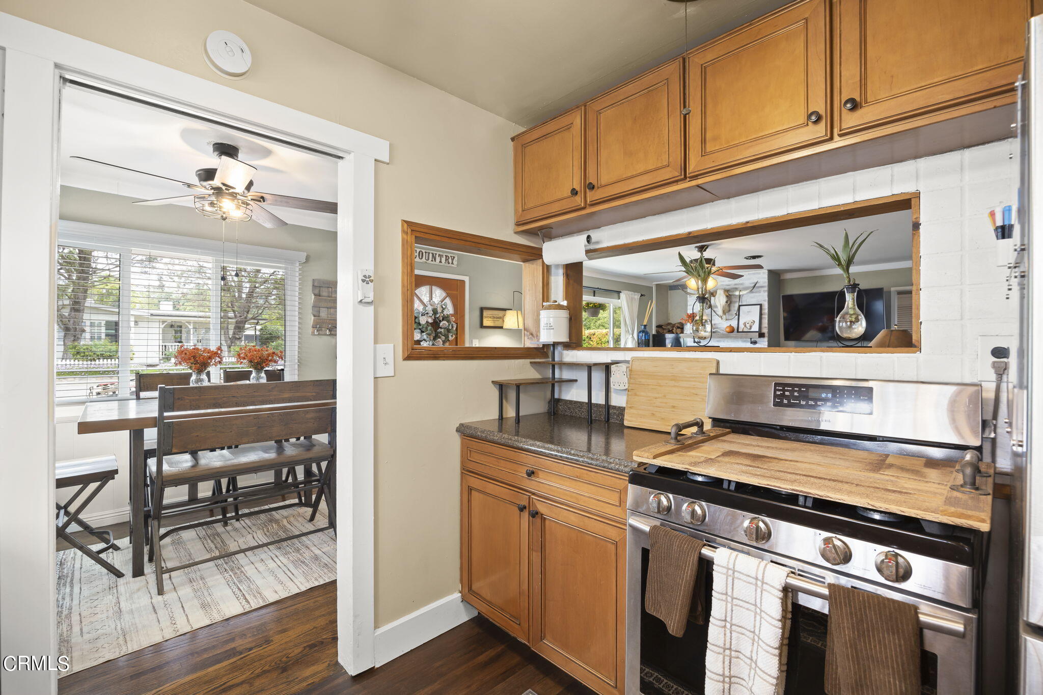 929 Devereux Drive Ojai, CA 93023 - Photo 14 of 40 a kitchen with stainless steel appliances granite countertop a stove and cabinets