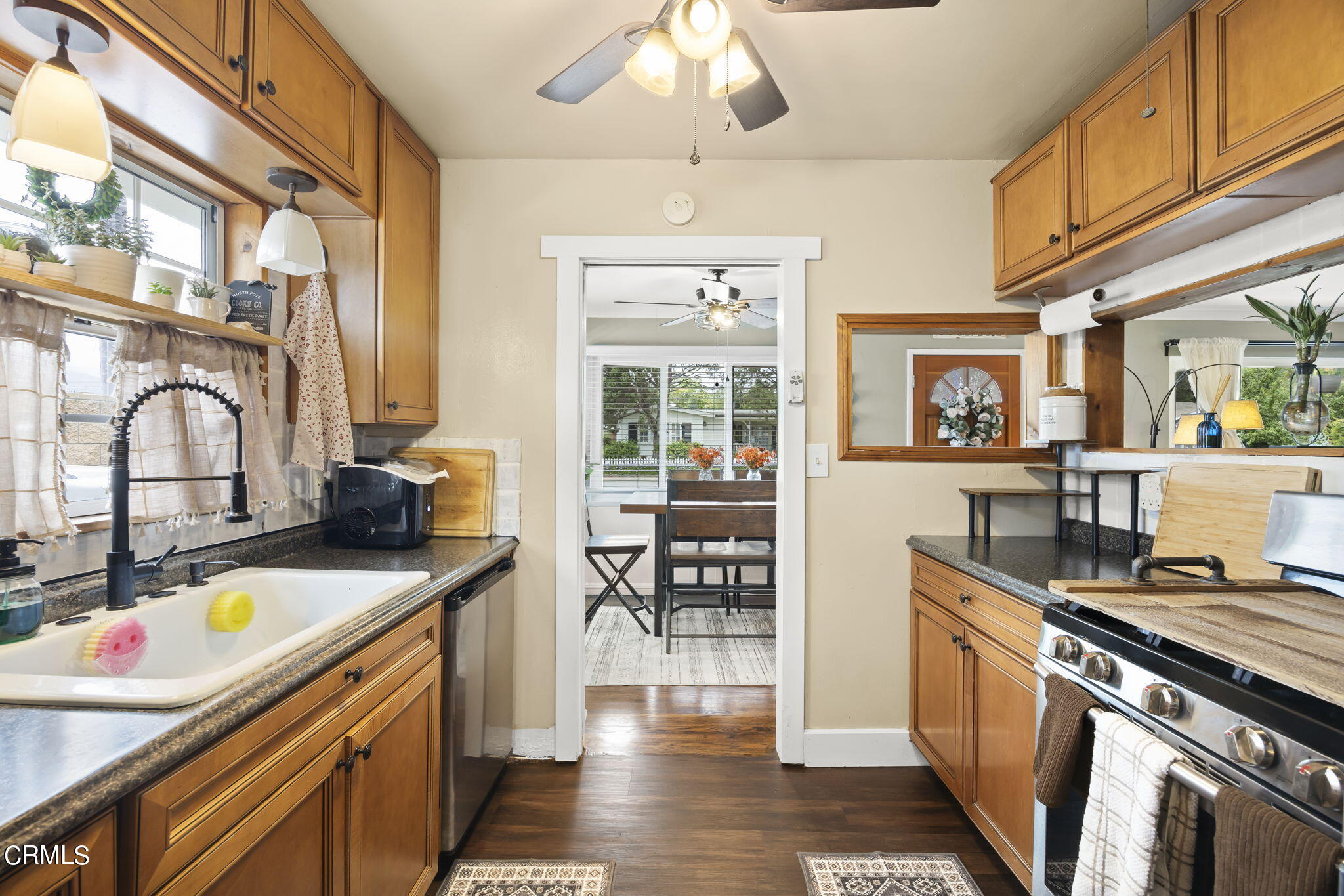 929 Devereux Drive Ojai, CA 93023 - Photo 15 of 40 a kitchen that has a lot of cabinets in it and wooden floors