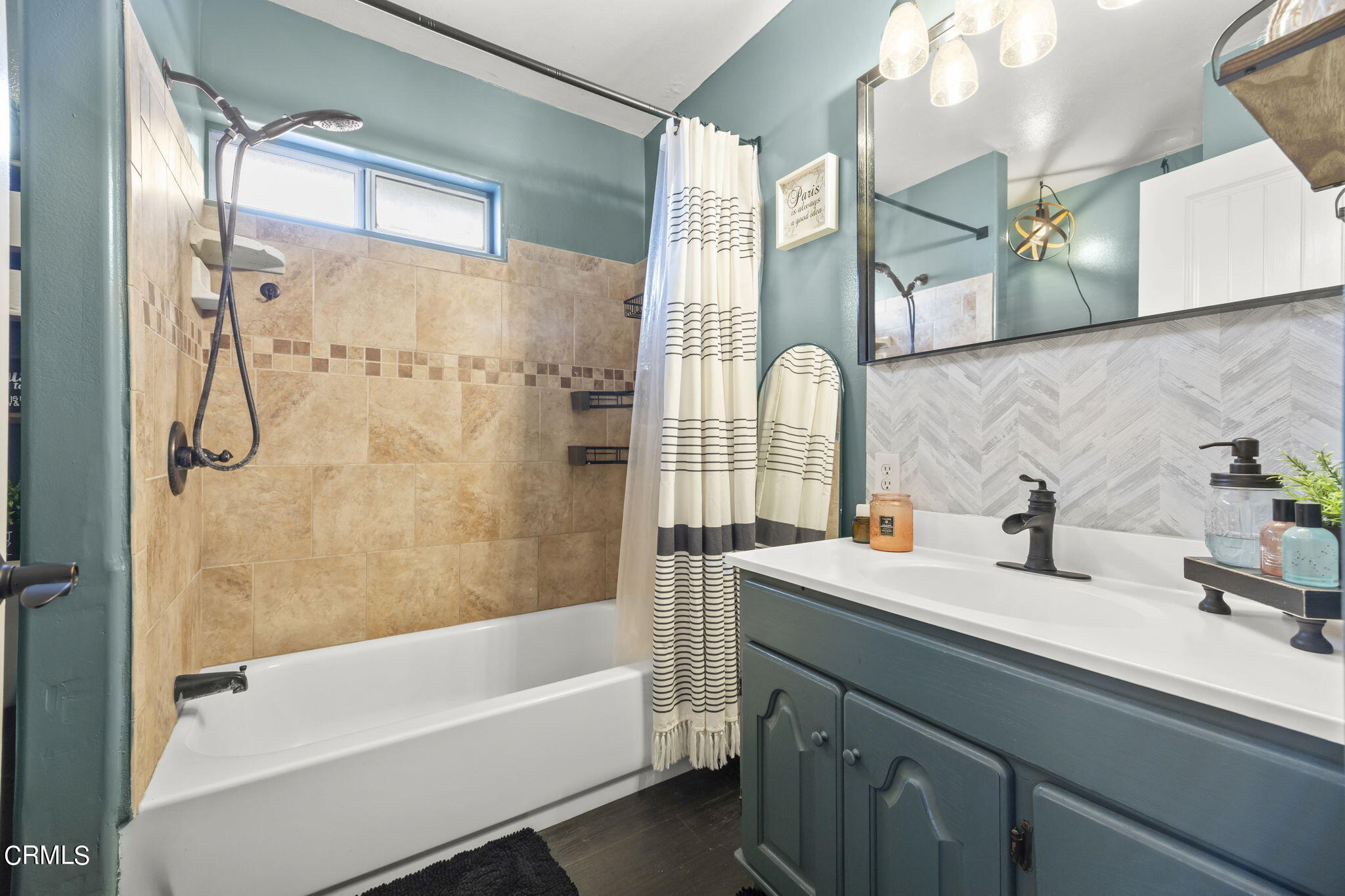 929 Devereux Drive Ojai, CA 93023 - Photo 25 of 40 a bathroom with a sink a mirror a bathtub and shower