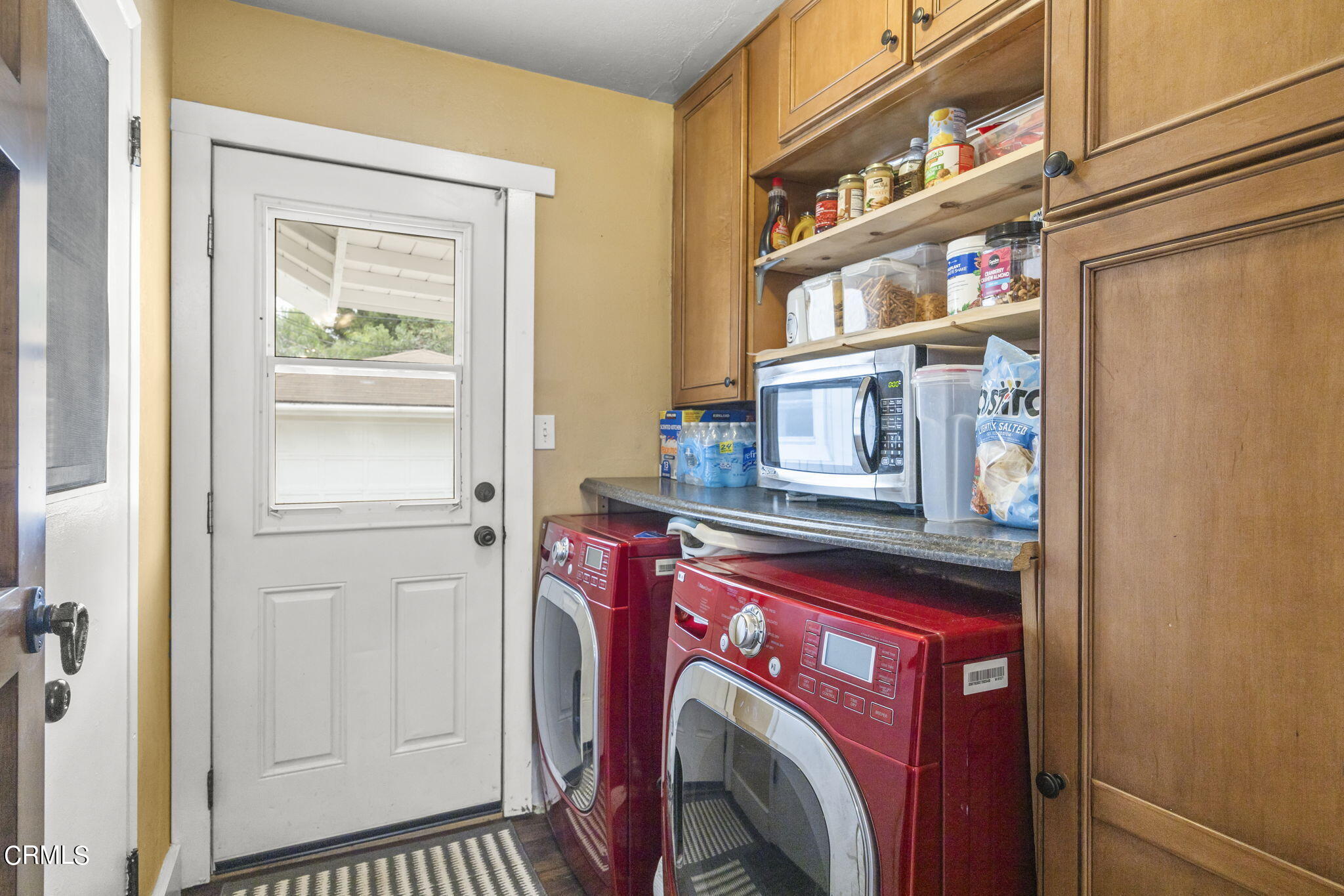 929 Devereux Drive Ojai, CA 93023 - Photo 27 of 40 a utility room with dryer and washer