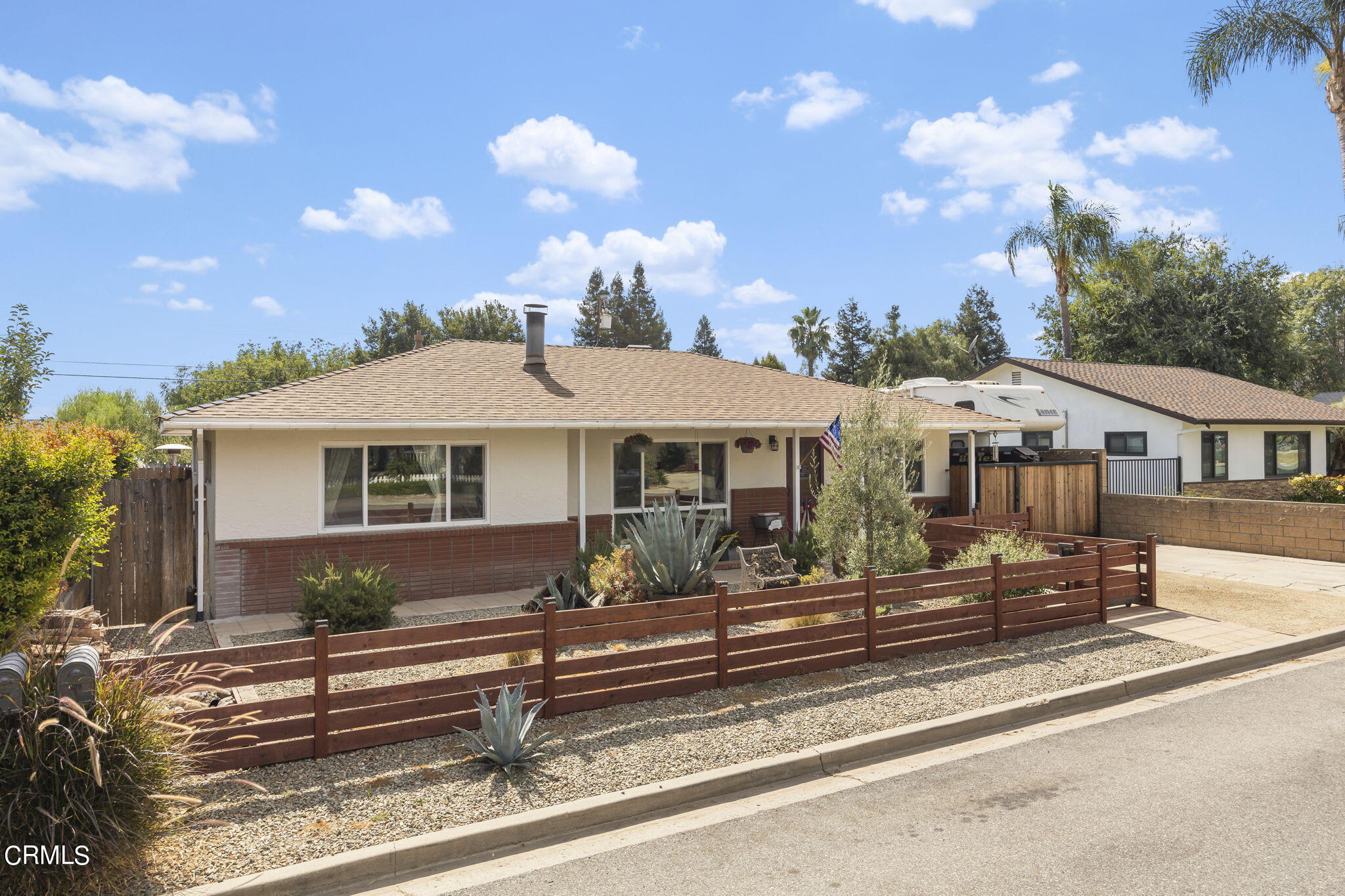 929 Devereux Drive Ojai, CA 93023 - Photo 3 of 40 a front view of a house with a garden