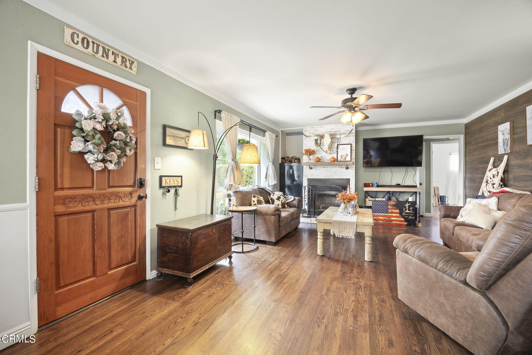 929 Devereux Drive Ojai, CA 93023 - Photo 6 of 40 a living room with furniture and a flat screen tv
