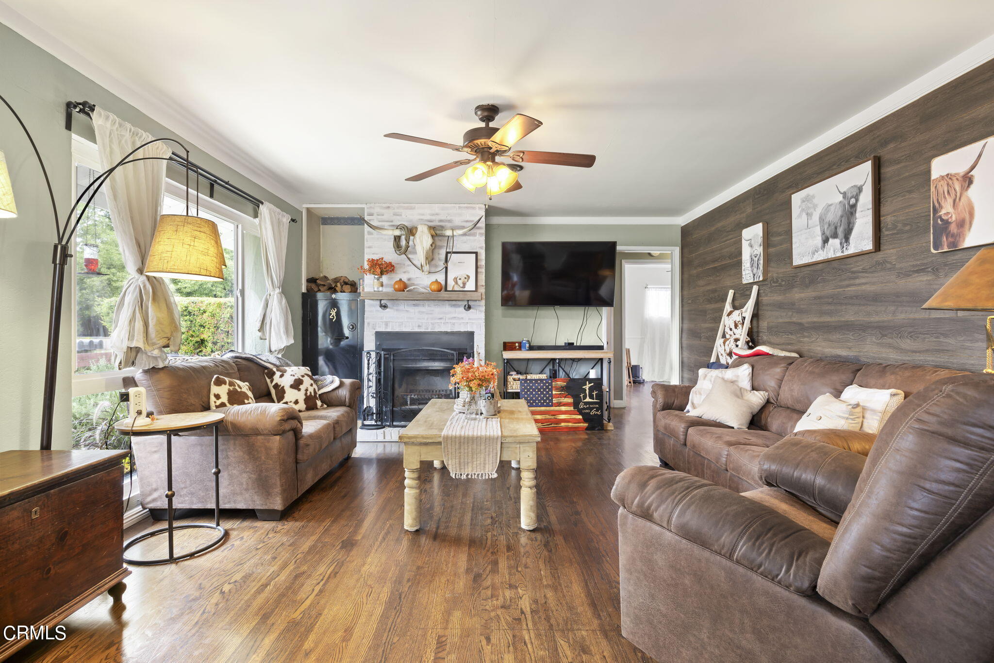 929 Devereux Drive Ojai, CA 93023 - Photo 7 of 40 a living room with fireplace furniture and a flat screen tv