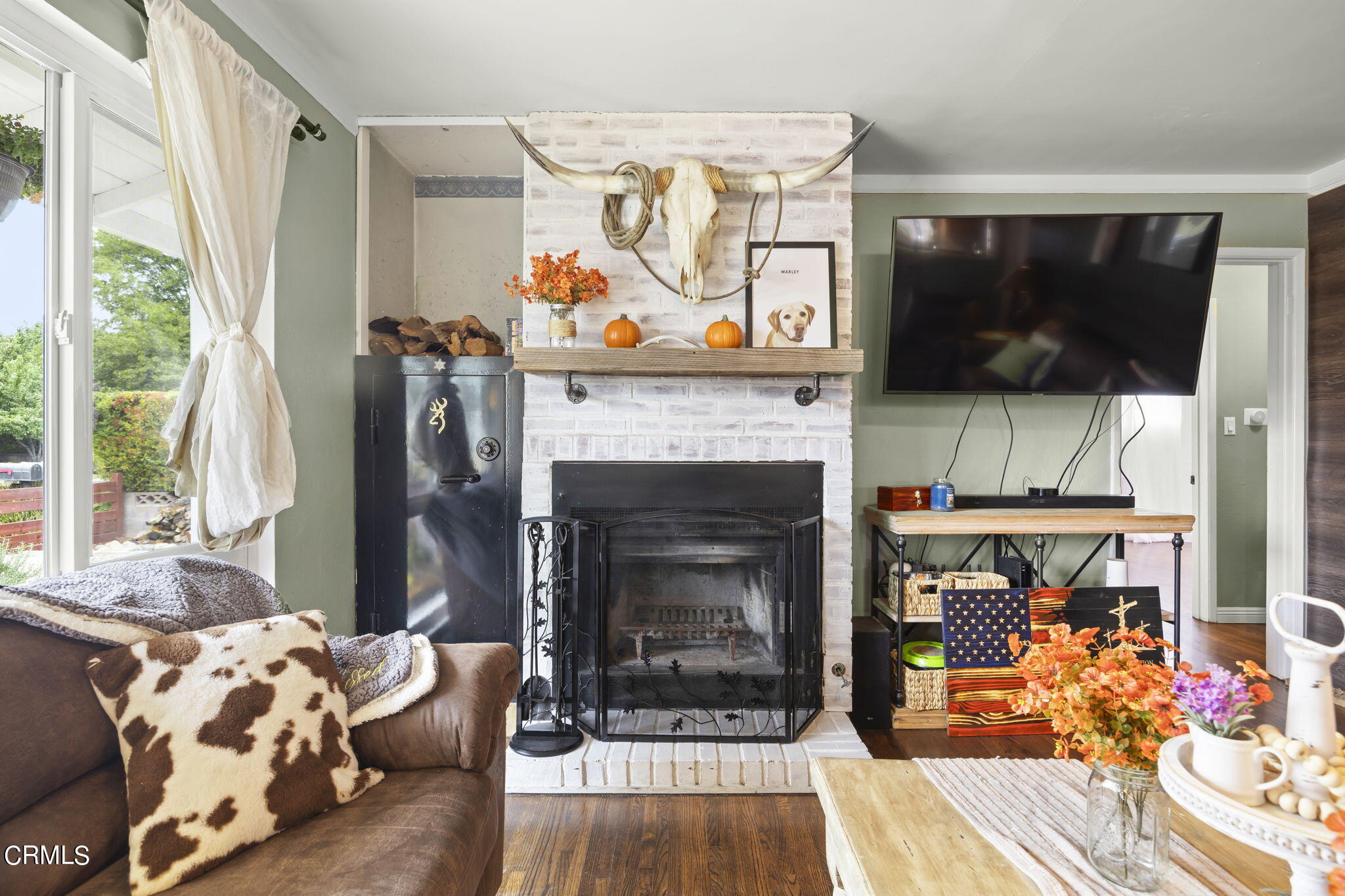 929 Devereux Drive Ojai, CA 93023 - Photo 8 of 40 a living room with furniture and a flat screen tv