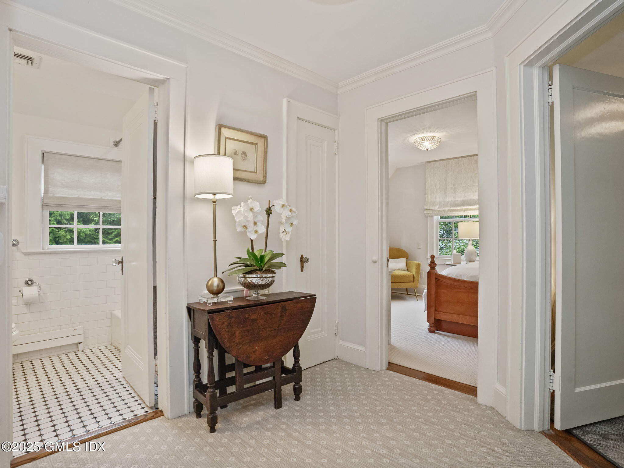 143 Lockwood Road Riverside, CT 06878 - Photo 13 of 39 a view of a hallway and dining room with furniture