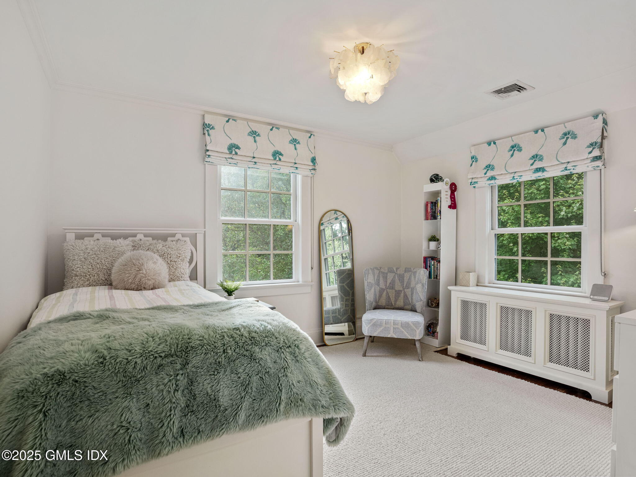 143 Lockwood Road Riverside, CT 06878 - Photo 16 of 39 a spacious bedroom with a bed and a window