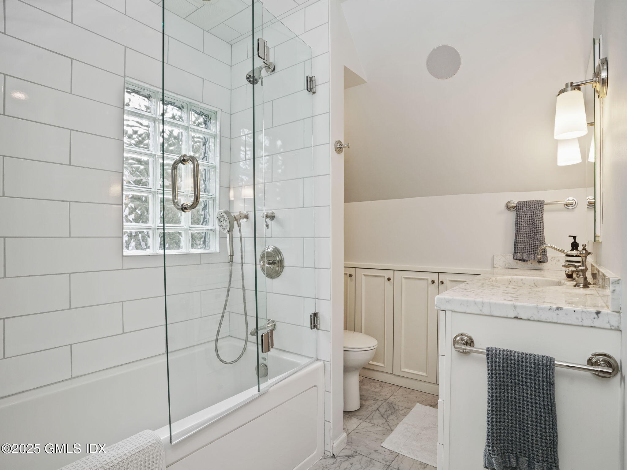 143 Lockwood Road Riverside, CT 06878 - Photo 20 of 39 a bathroom with a granite countertop sink a toilet and shower
