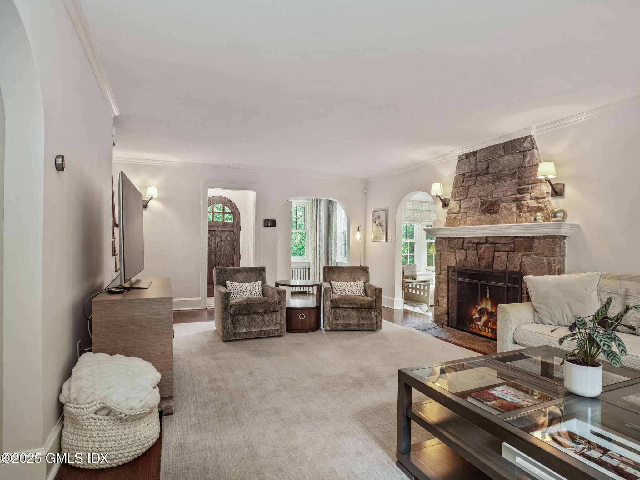 143 Lockwood Road Riverside, CT 06878 - Photo 3 of 39 a living room with furniture and a fireplace