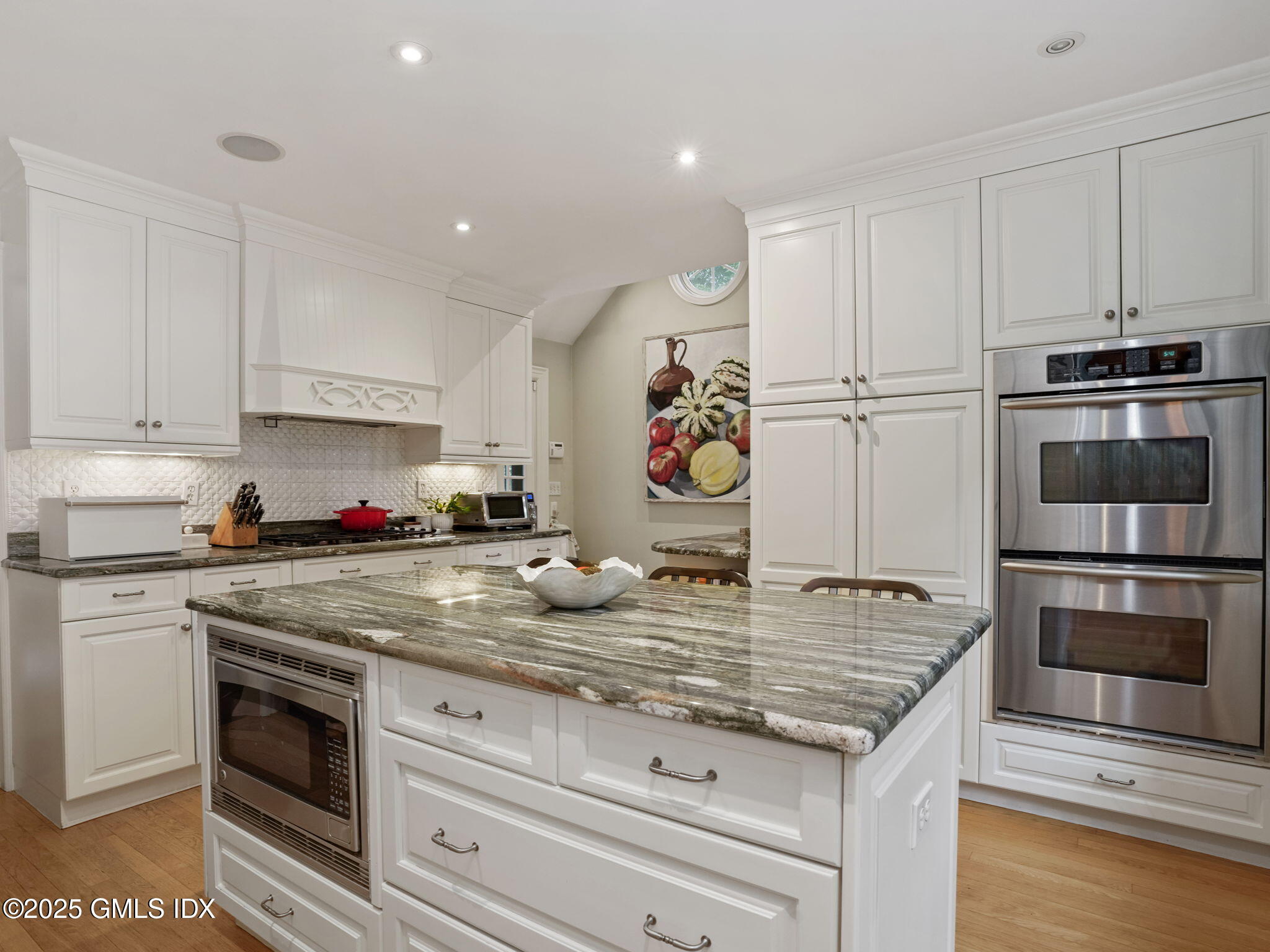 143 Lockwood Road Riverside, CT 06878 - Photo 9 of 39 a kitchen with granite countertop a stove and a sink
