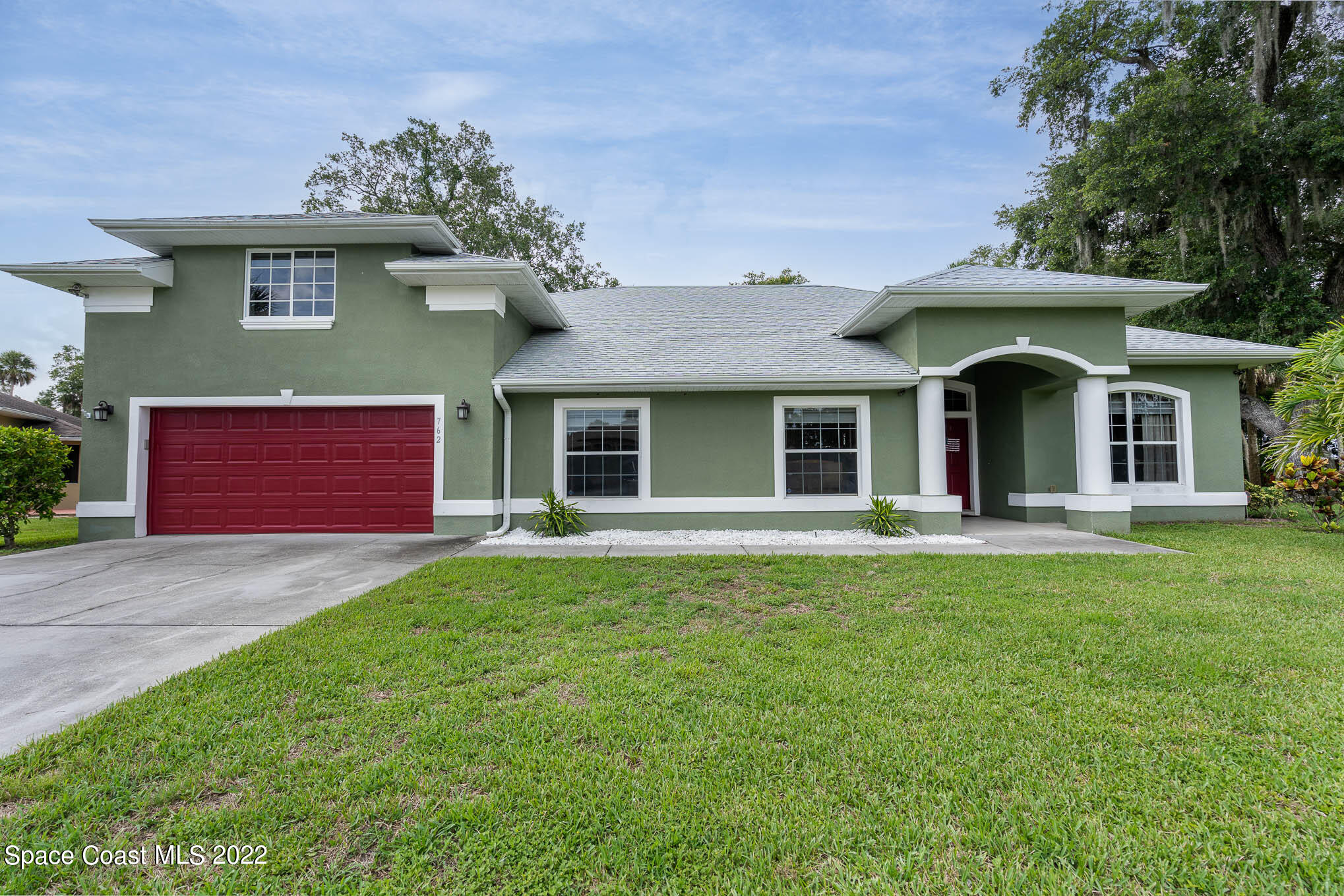 front view of a house with a yard