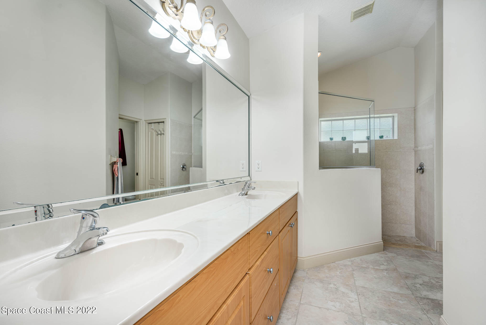762 Seymour Road Northeast Palm Bay, FL 32905 - Photo 15 of 29 a bathroom with a sink and a mirror