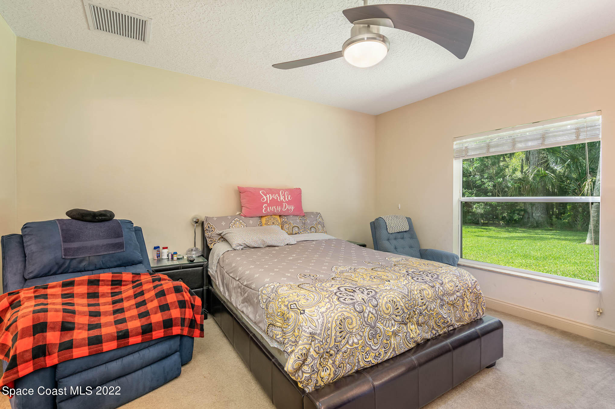 762 Seymour Road Northeast Palm Bay, FL 32905 - Photo 22 of 29 a bedroom with a bed and window