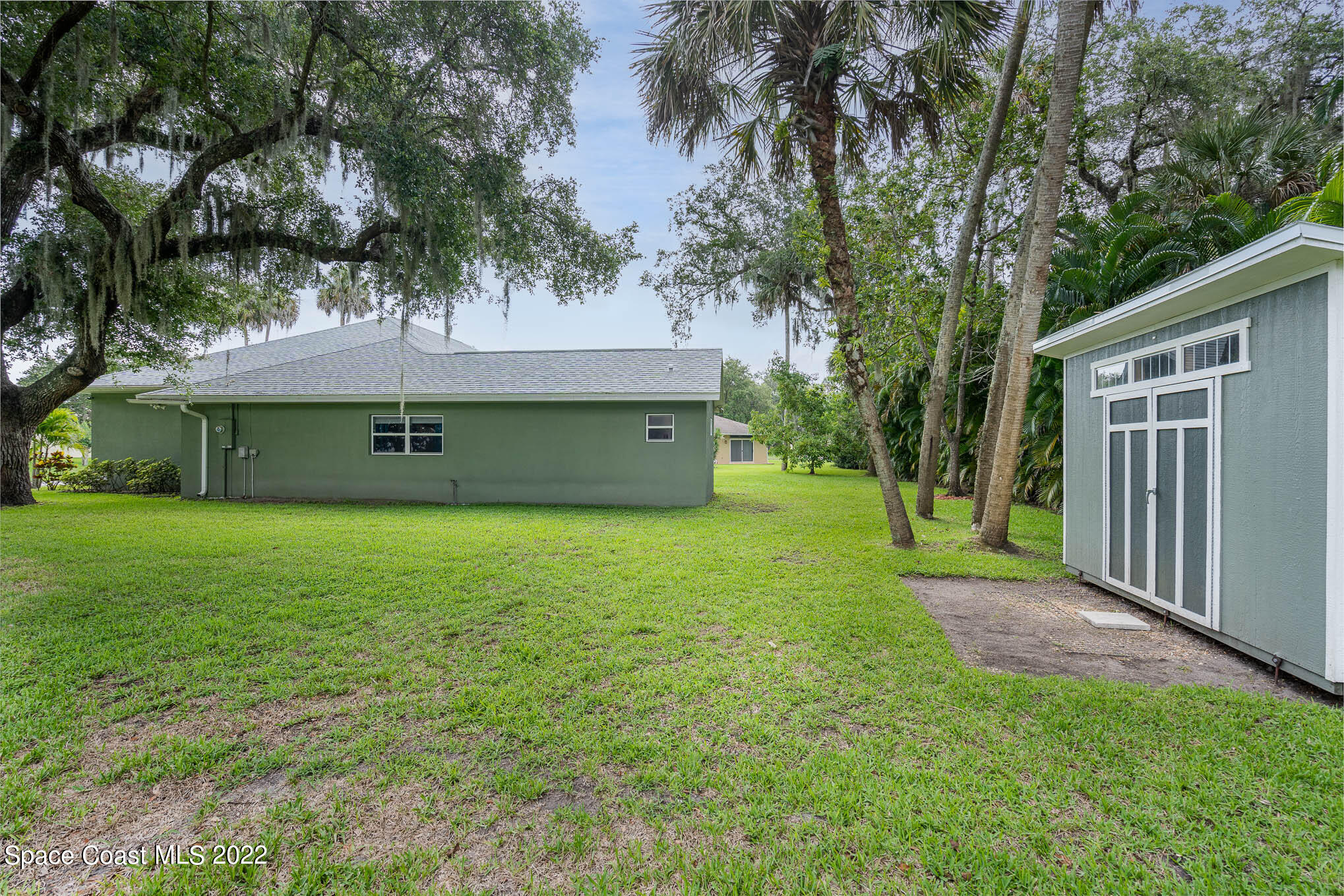 762 Seymour Road Northeast Palm Bay, FL 32905 - Photo 25 of 29 a front view of house with yard and green space