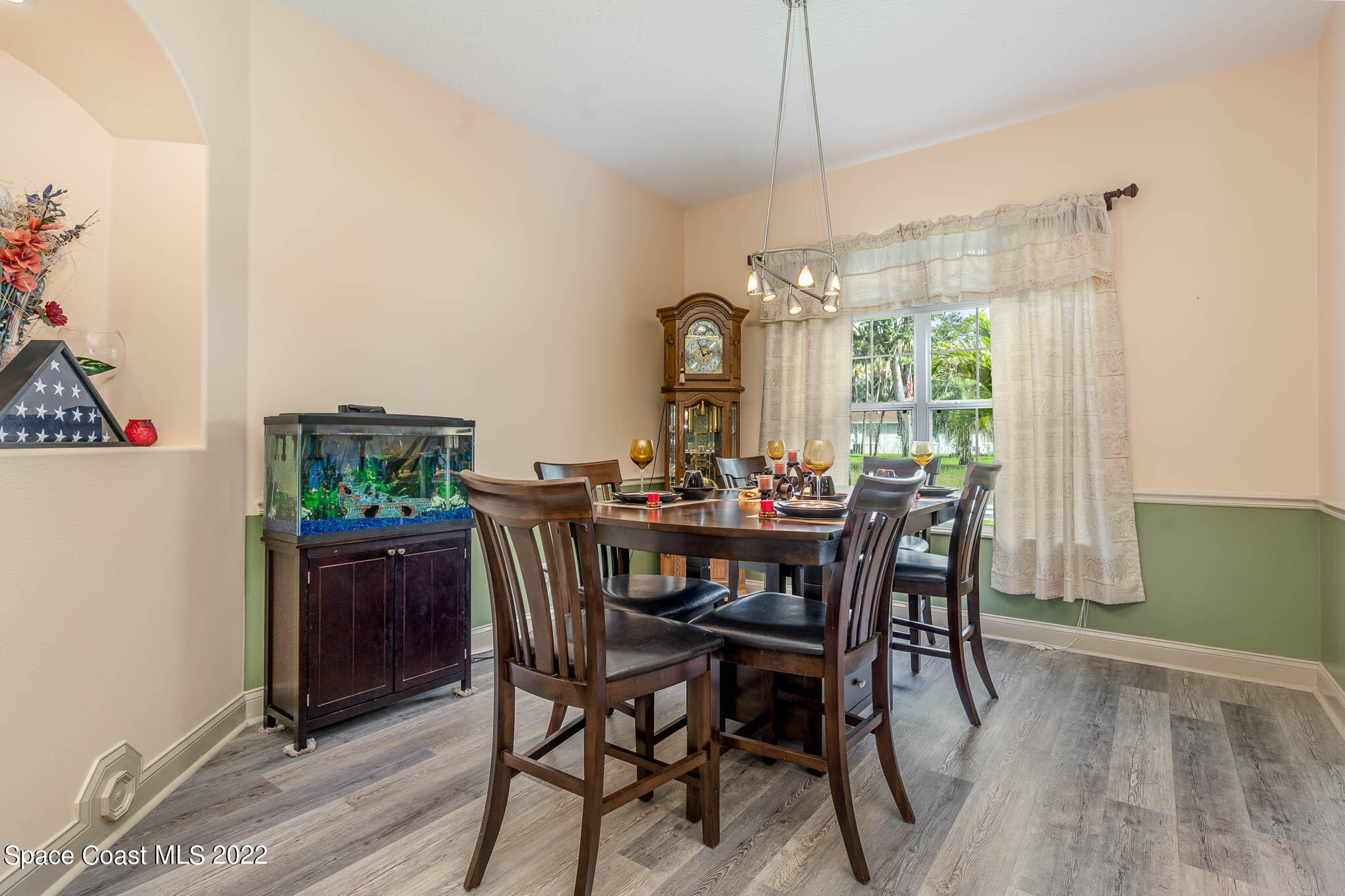 762 Seymour Road Northeast Palm Bay, FL 32905 - Photo 6 of 29 a view of a dining room with furniture window and outside view