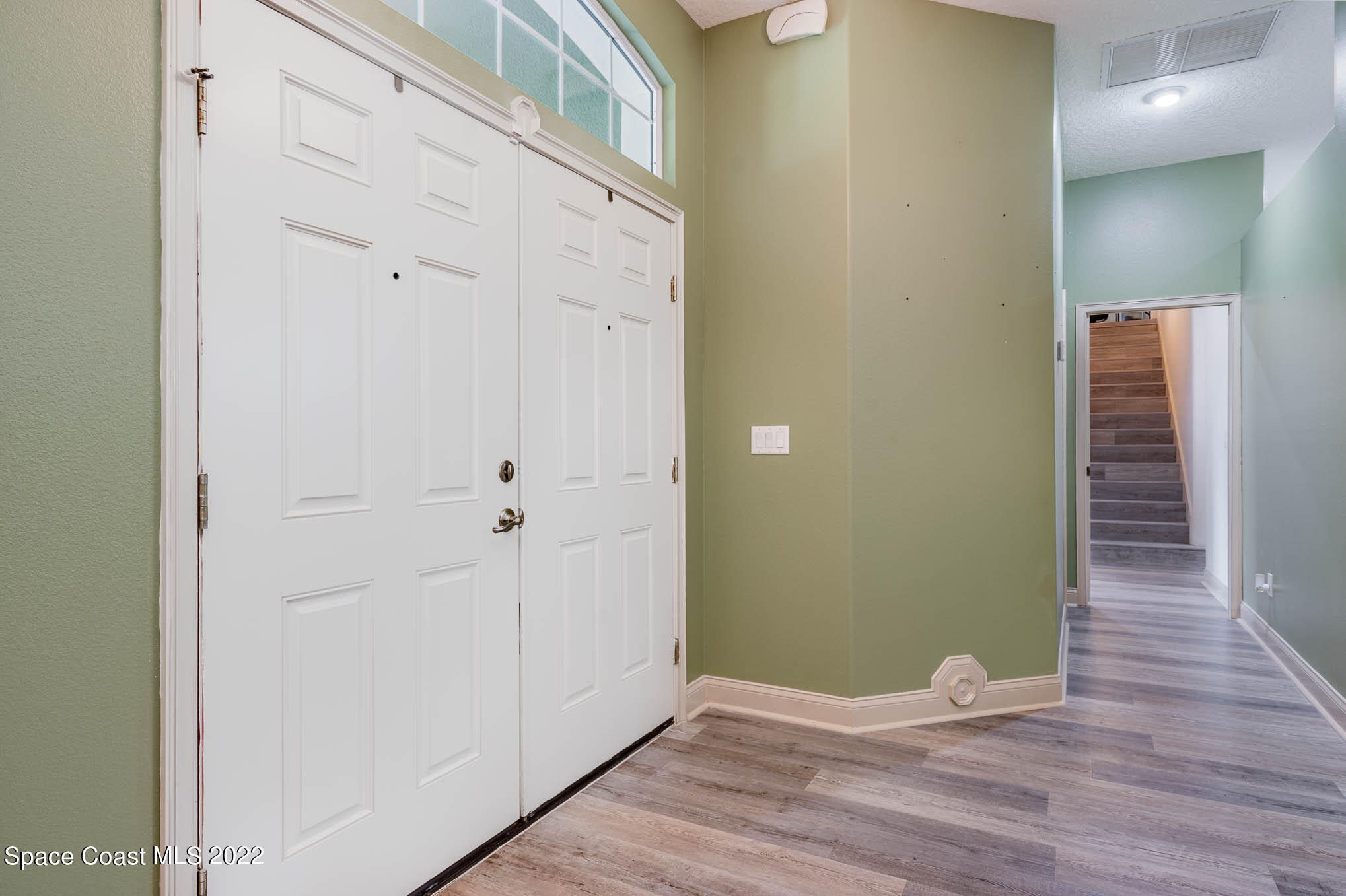 762 Seymour Road Northeast Palm Bay, FL 32905 - Photo 7 of 29 a view of empty room with wooden floor