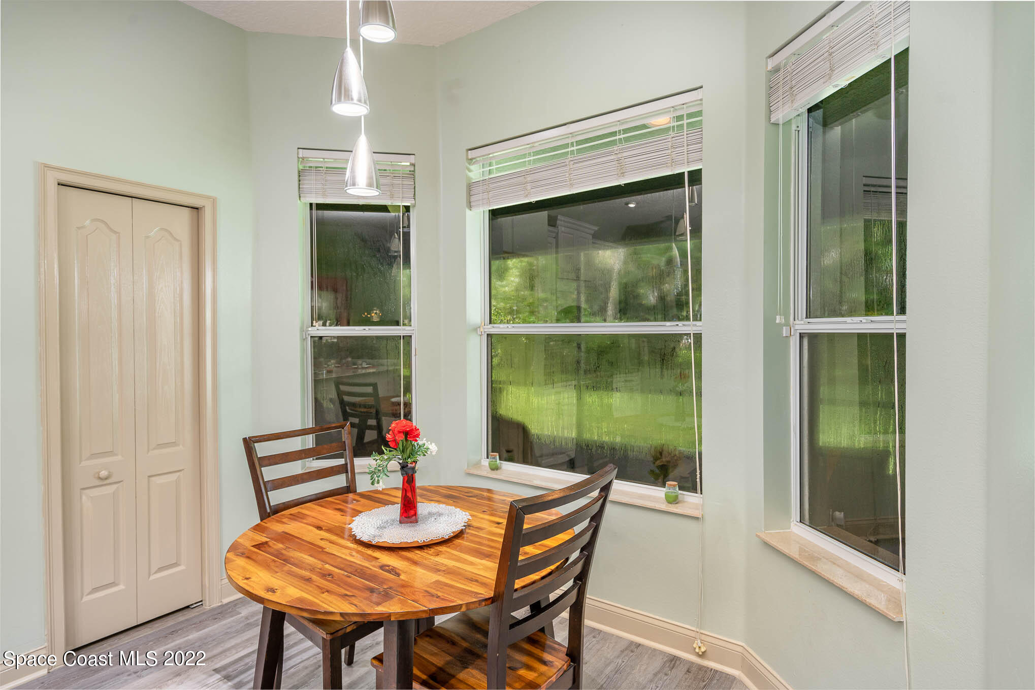 762 Seymour Road Northeast Palm Bay, FL 32905 - Photo 10 of 29 a table and chairs in a room