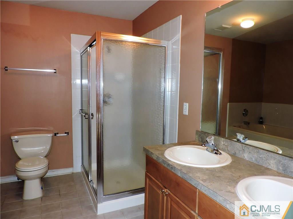 206 Hawthorne Road North Brunswick, NJ 08902 - Photo 13 of 24 a bathroom with a granite countertop sink toilet and shower