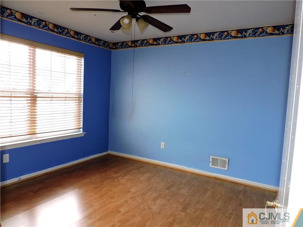 206 Hawthorne Road North Brunswick, NJ 08902 - Photo 15 of 24 a view of an empty room with a window