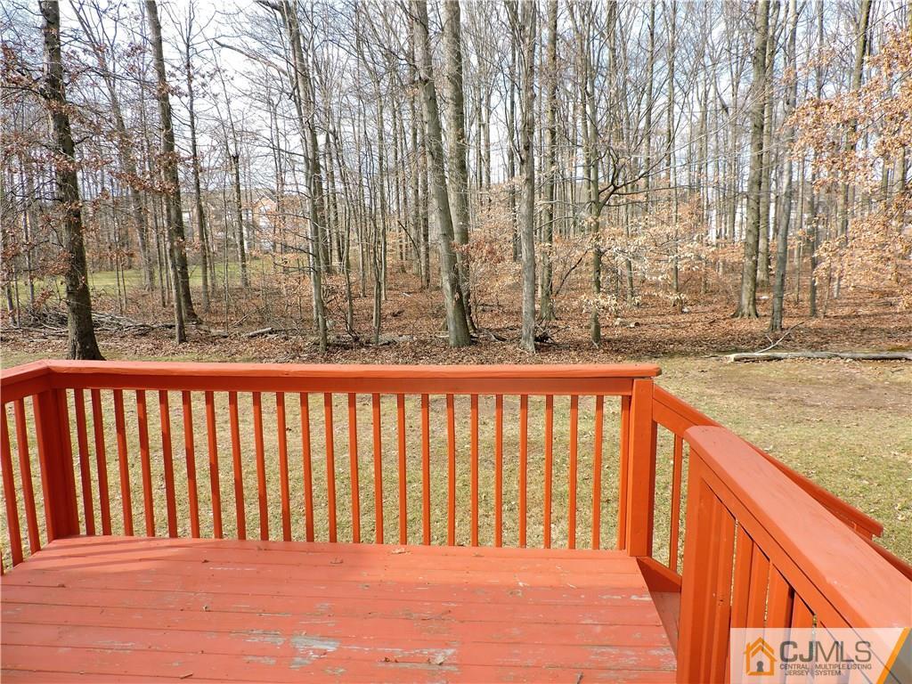 206 Hawthorne Road North Brunswick, NJ 08902 - Photo 22 of 24 a balcony with trees in front of it