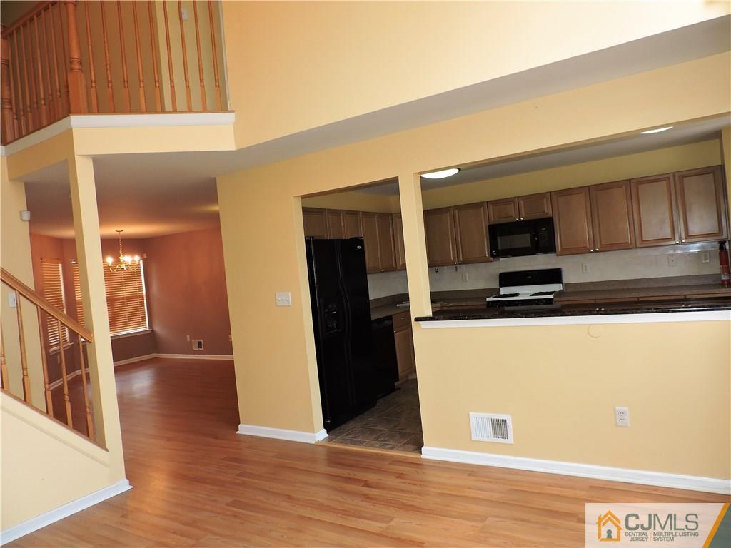 206 Hawthorne Road North Brunswick, NJ 08902 - Photo 5 of 24 a view of a kitchen from the hallway