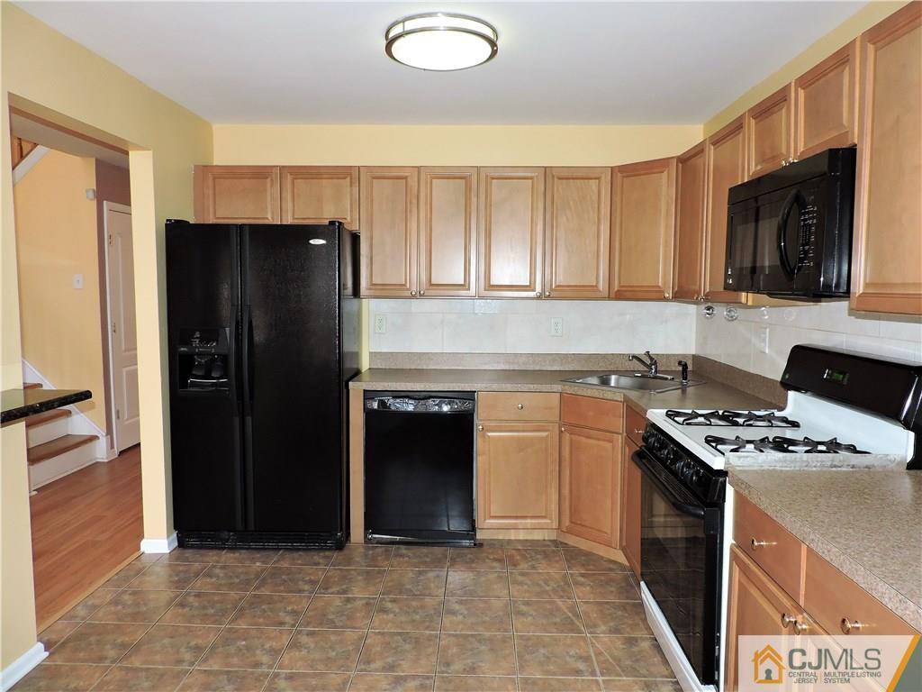206 Hawthorne Road North Brunswick, NJ 08902 - Photo 8 of 24 a kitchen with stainless steel appliances granite countertop a refrigerator stove and sink