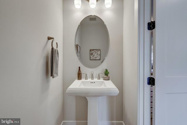 a living room with fireplace furniture and a flat screen tv
