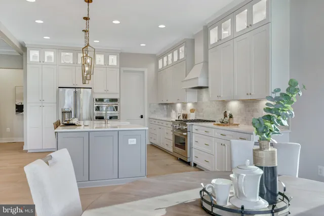 a bathroom with double vanity sinks and a mirror