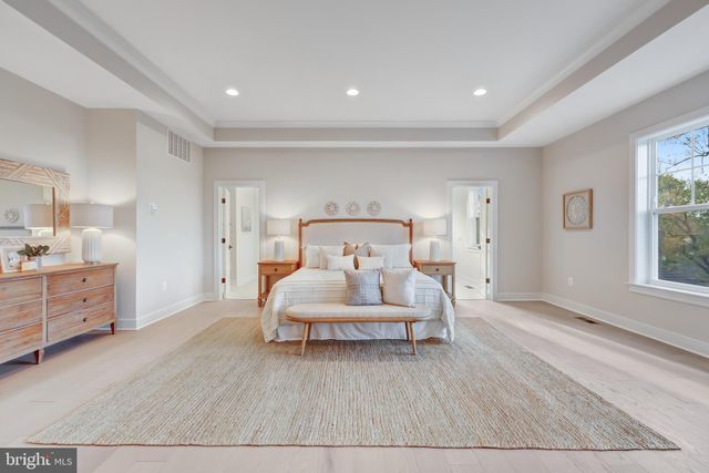 a bed room with furniture and white walls