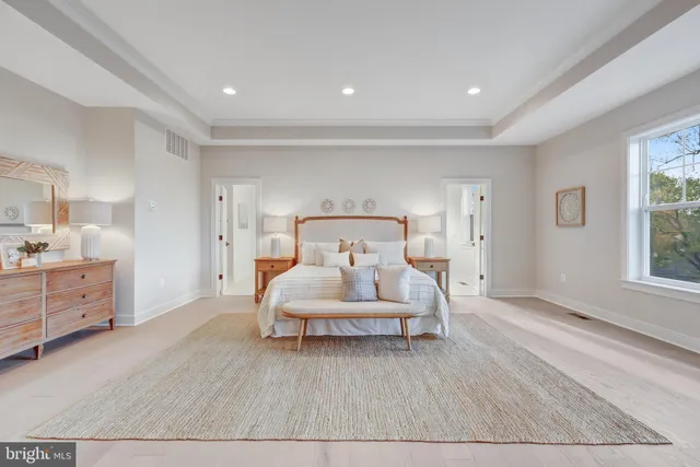 a bed room with furniture and white walls