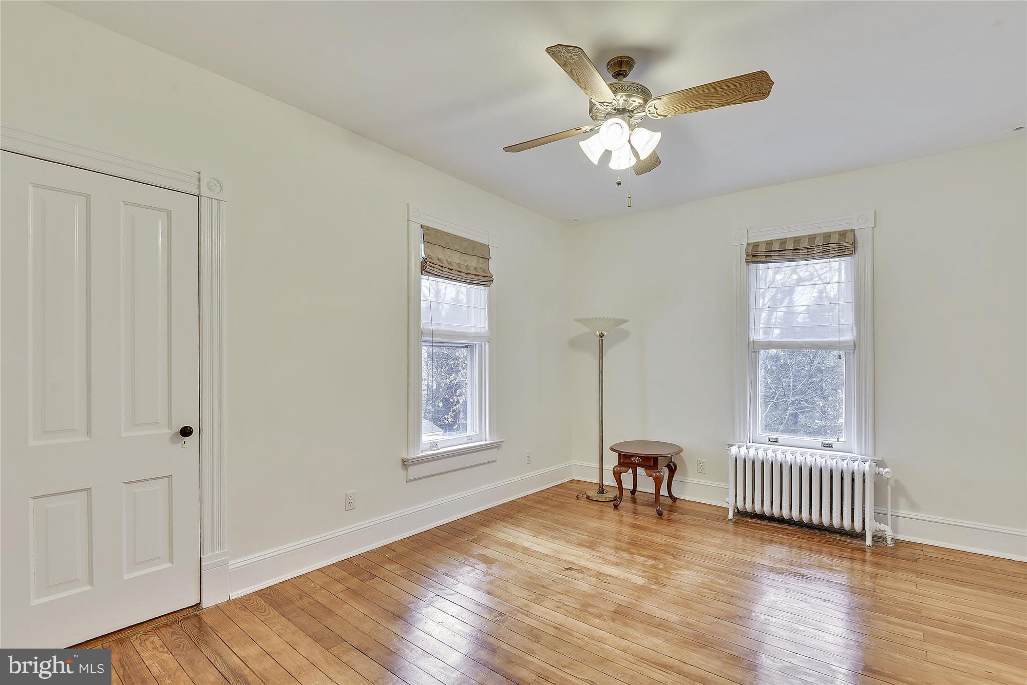 2200 Salisbury Road Silver Spring, MD 20910 - Photo 14 of 26 a view of an empty room with a window and wooden floor