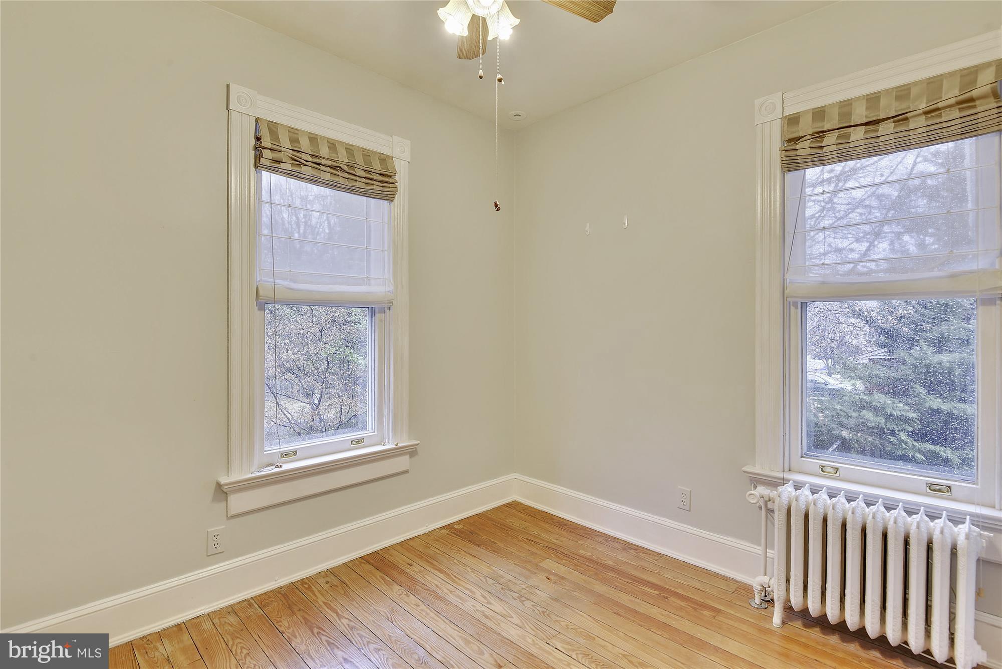 2200 Salisbury Road Silver Spring, MD 20910 - Photo 15 of 26 a view of an empty room with wooden floor and a window