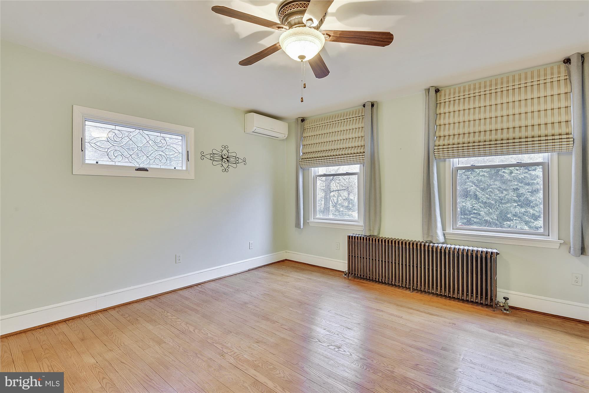 2200 Salisbury Road Silver Spring, MD 20910 - Photo 17 of 26 a view of an empty room with window and wooden floor